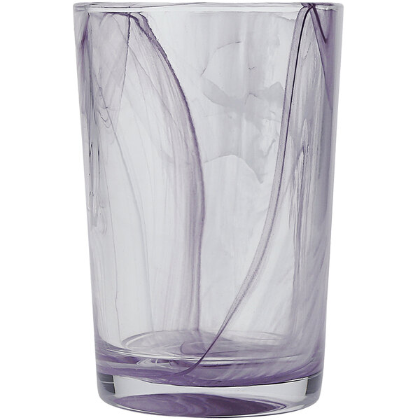 A clear Fortessa beverage glass with purple swirls on it.