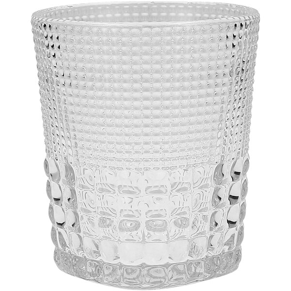 A Fortessa Malcolm clear glass rocks glass with a textured pattern.