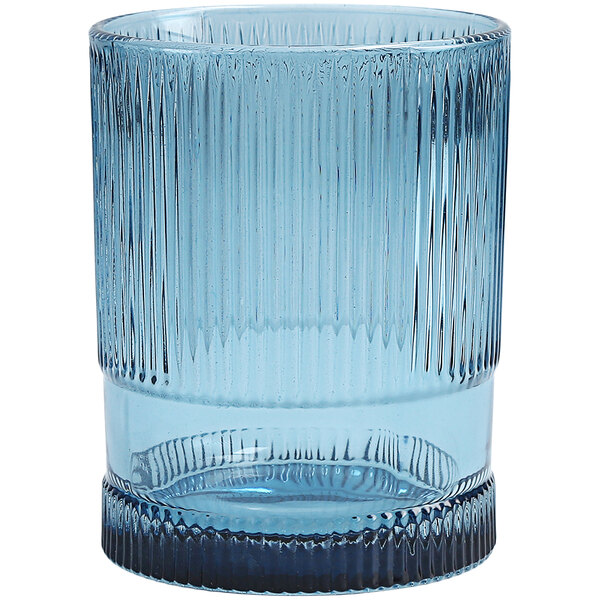 A Fortessa NoHo blue beverage glass with a ribbed design.