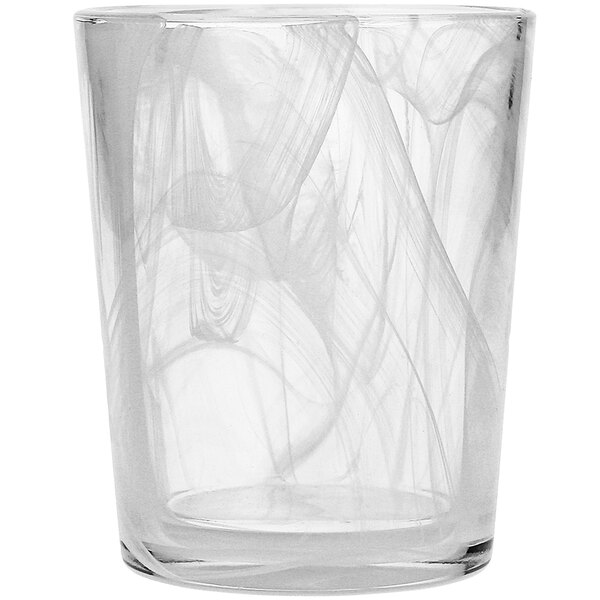 A clear Fortessa double old fashioned glass with a white swirl design.