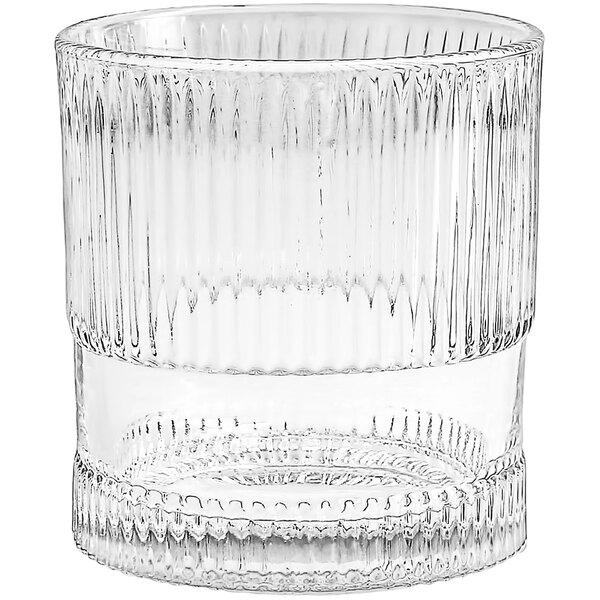 A clear Fortessa NoHo rocks glass with a curved edge.