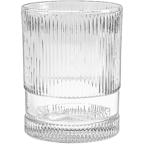 A clear Fortessa NoHo beverage glass with a ribbed design.