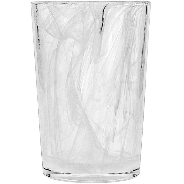 A Fortessa beverage glass with a white swirl design.
