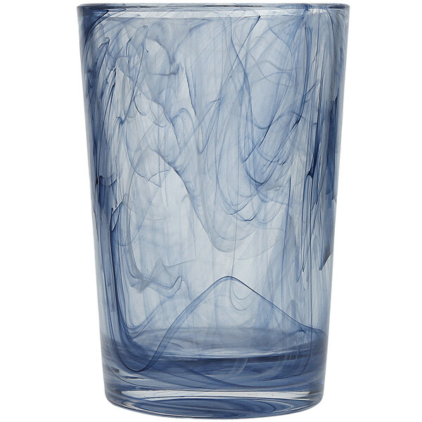 A Fortessa ink blue beverage glass with swirls on it.