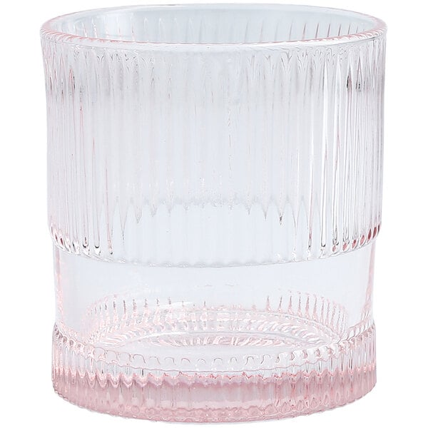 A clear Fortessa NoHo double old fashioned glass with a pink rim.