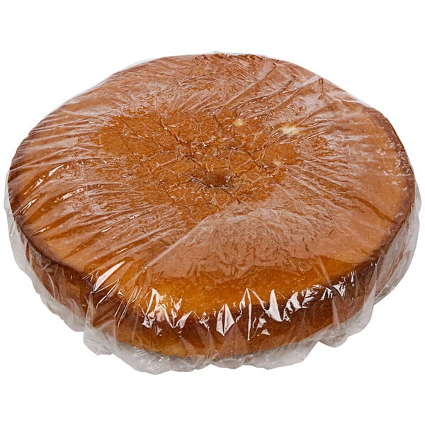 A Rich's Allen white layer cake wrapped in plastic.