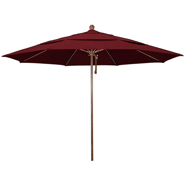 A red umbrella with a wooden pole.