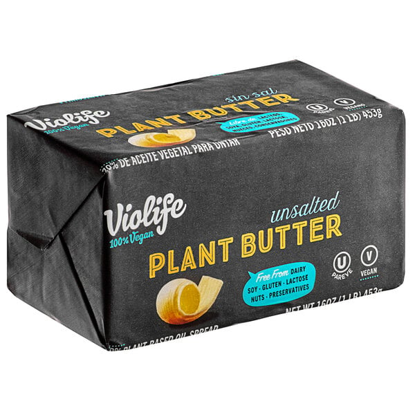 A black package of Violife Plant-Based Vegan Unsalted Butter bricks on a counter.