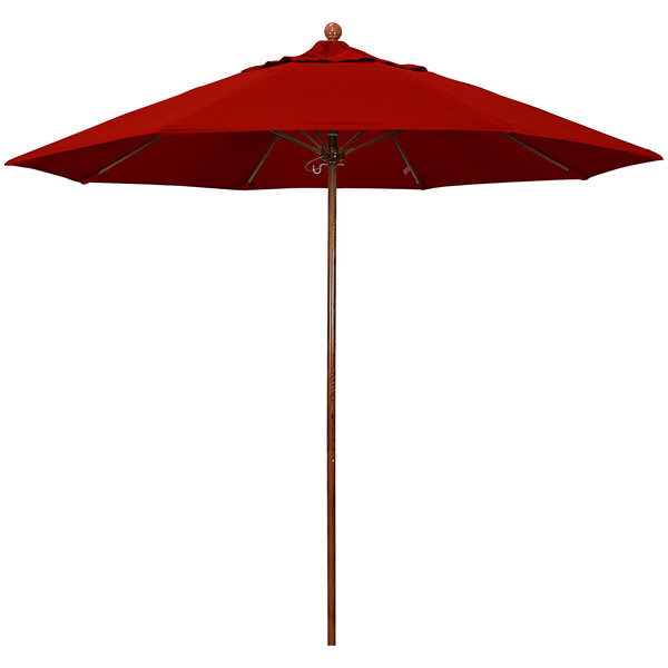 A California Umbrella with a red Sunbrella canopy, American oak pole, and wooden base.