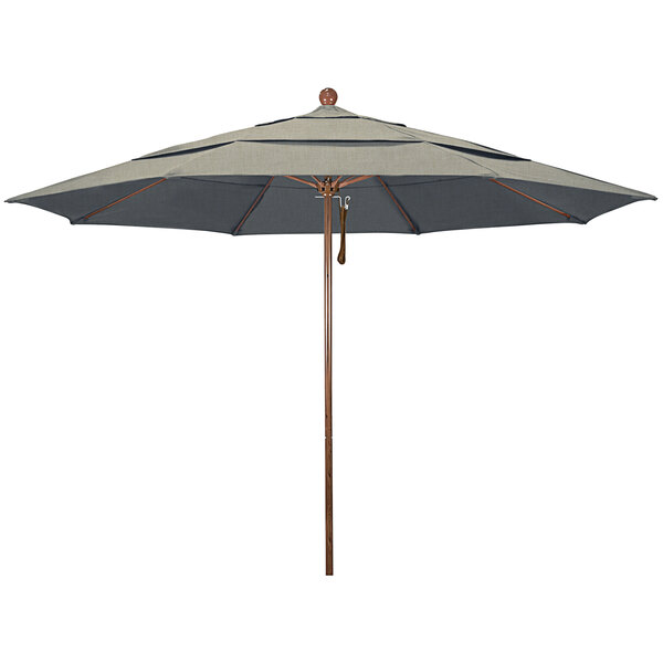 A grey California Umbrella with a wooden pole and a black and white striped Sunbrella canopy.