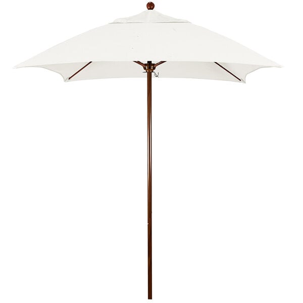A white umbrella with a wooden pole.