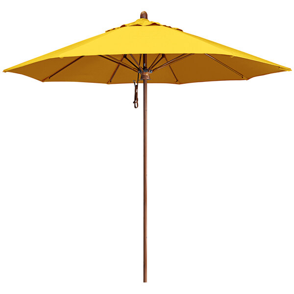A California Umbrella yellow Sunbrella canopy with a wood pole.