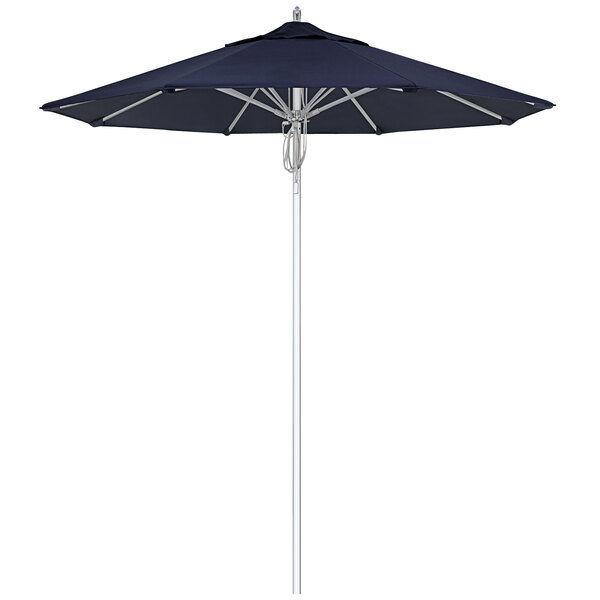 A close up of a blue California Umbrella with a silver pole.