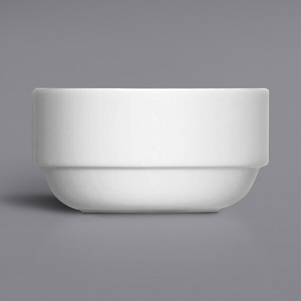 A Bauscher by BauscherHepp Modulus bright white porcelain bowl on a gray surface.