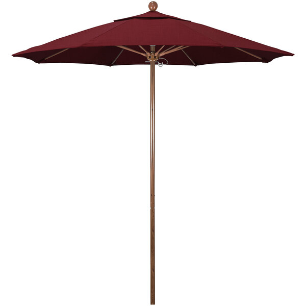 A California Umbrella with a red Sunbrella canopy on a red pole.