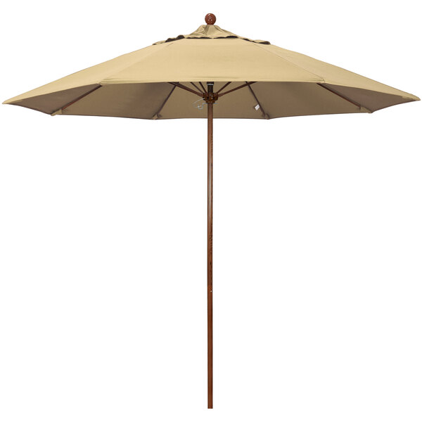 A California Umbrella beige outdoor table umbrella with a wooden pole.