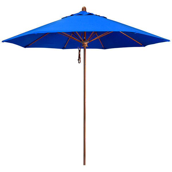 A California Umbrella blue Sunbrella canopy with a wood pole.