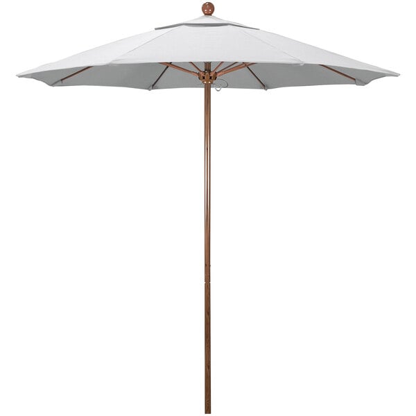 A white California Umbrella with a wooden pole.