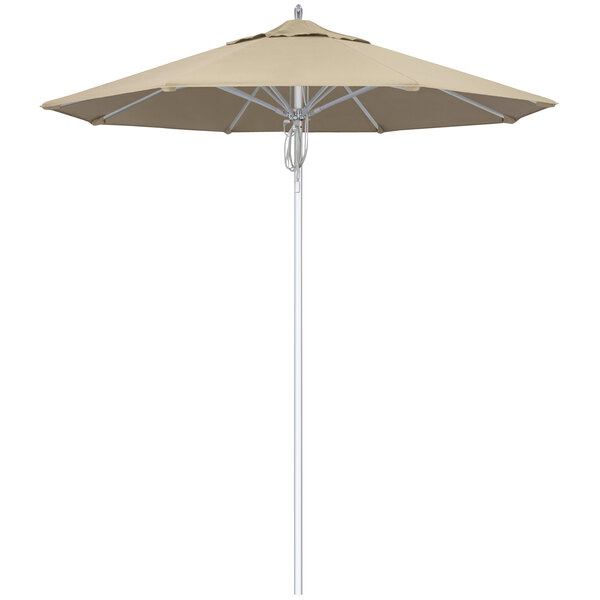 A beige California Umbrella with a silver pole.
