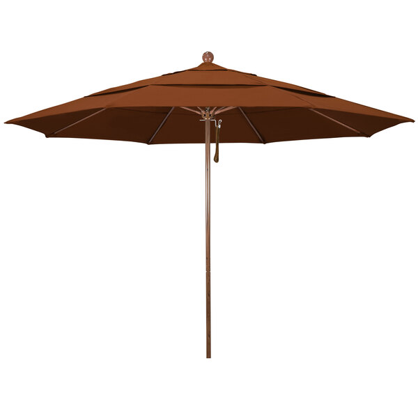 A close-up of a California Umbrella with a brown Pacifica canopy and a wooden pole.