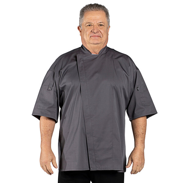 A man wearing a slate gray Uncommon Chef short sleeve chef coat.