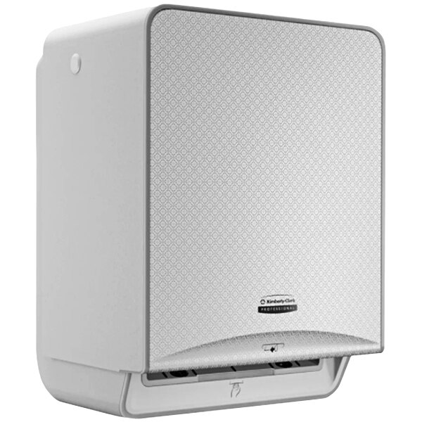 A white rectangular Kimberly-Clark Professional paper towel dispenser with a silver mosaic faceplate.