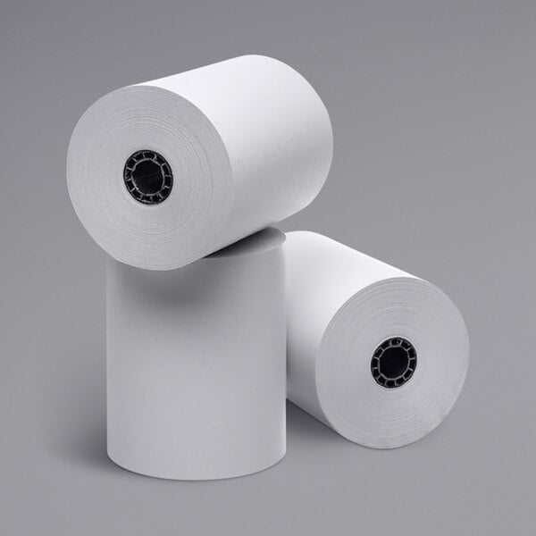 A stack of Point Plus white thermal paper rolls.