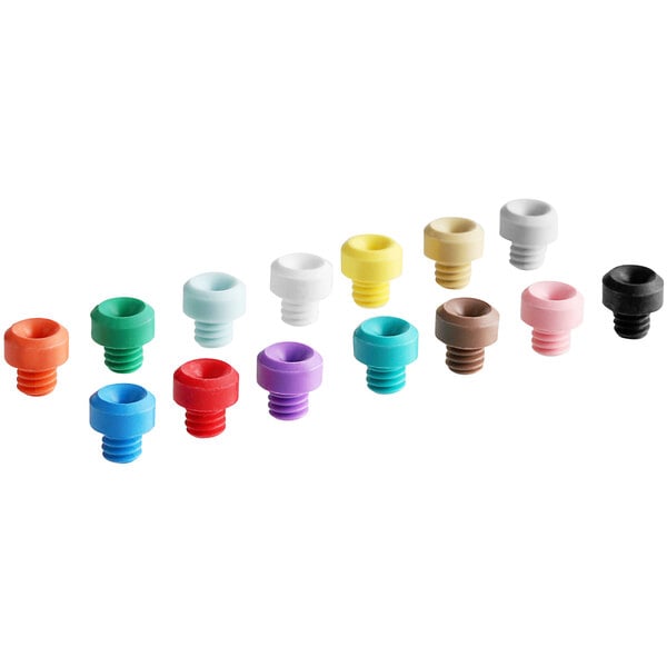 A set of colorful Dema metering tips with screws.