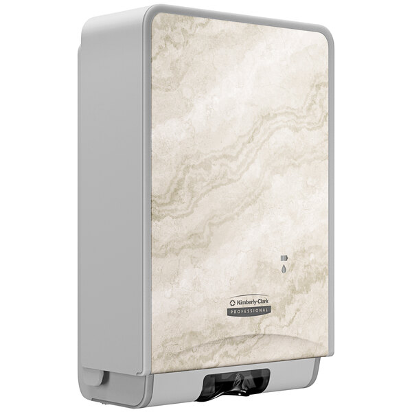 A Kimberly-Clark Professional white and grey soap dispenser with a warm marble faceplate.