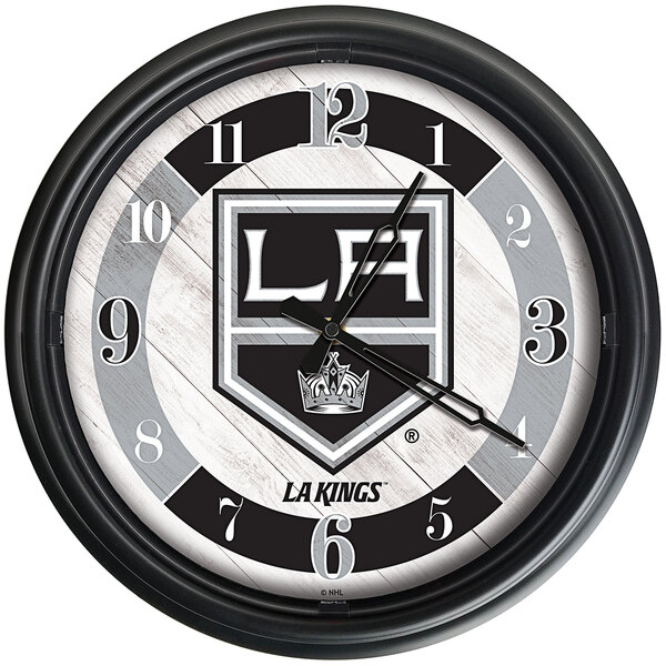 A black Holland Bar Stool Los Angeles Kings wall clock with a logo.
