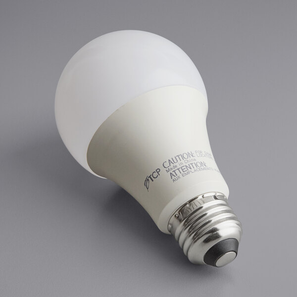 A TCP Pro Line dimmable LED light bulb with a white base and frosted glass.