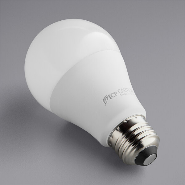 A TCP dimmable LED light bulb shining white light.