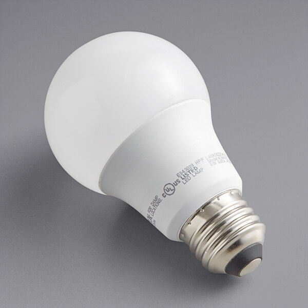 A TCP dimmable LED A19 light bulb with white light on a gray background.