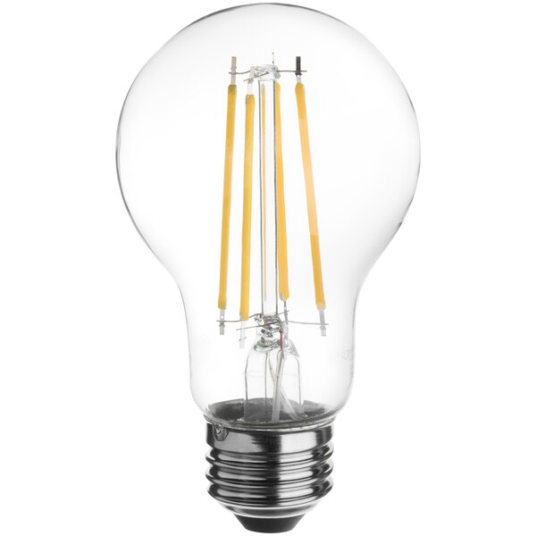 A TCP clear LED filament light bulb glowing yellow.