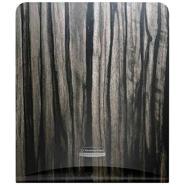 A Kimberly-Clark Professional ICON woodgrain faceplate for an automatic paper towel dispenser with a wood grain pattern.