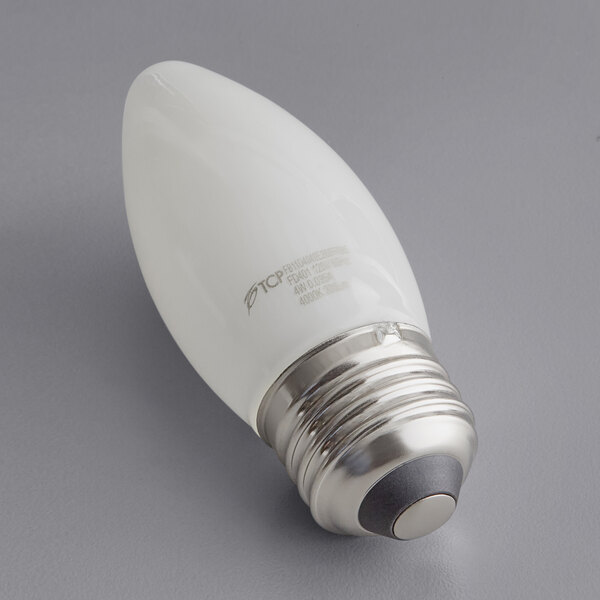A TCP dimmable LED frosted filament light bulb with a silver base and rim.