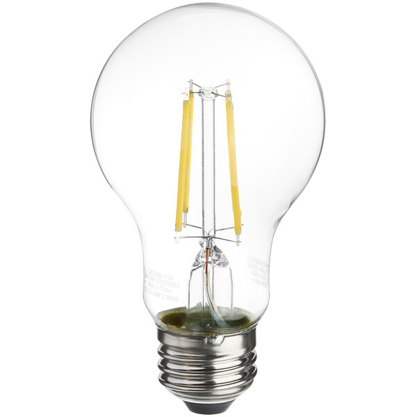 A TCP clear LED filament light bulb glowing white.