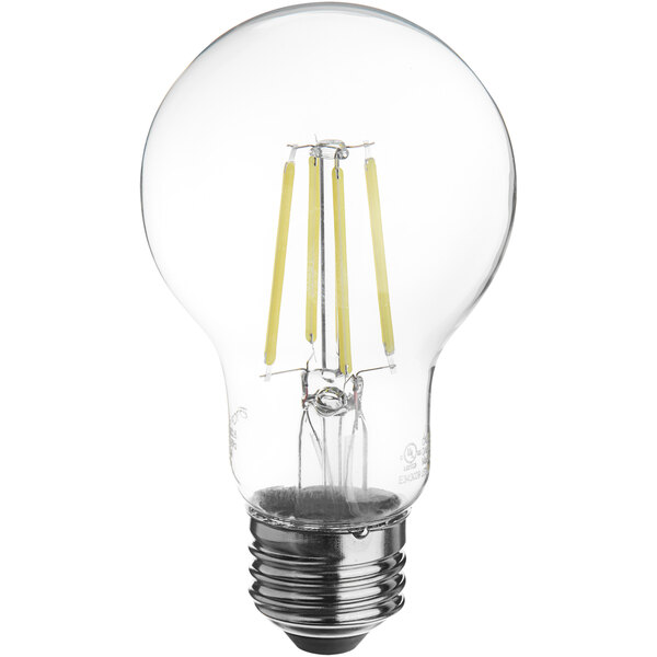 A TCP clear LED filament light bulb with a yellow light inside.