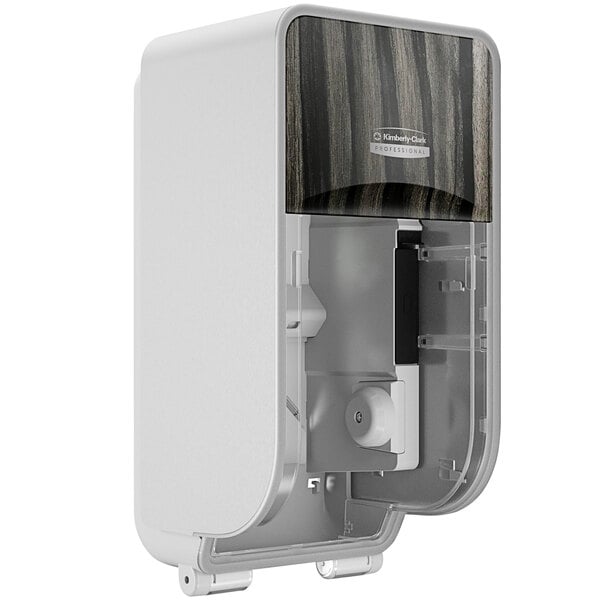 A white Kimberly-Clark Professional ICON Coreless Standard Roll toilet paper dispenser with a black and wood design.