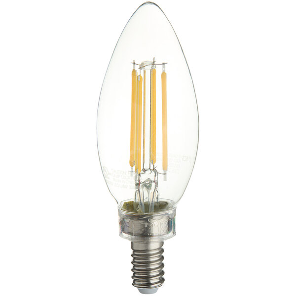 A close-up of a TCP clear dimmable LED filament bulb with an E12 base.
