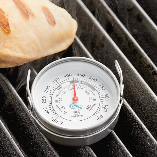 A Choice 2" Dial Grill Thermometer on a grill.