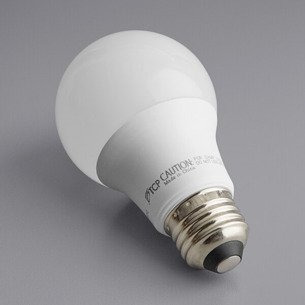 A TCP 6W LED light bulb with a light bulb on it.