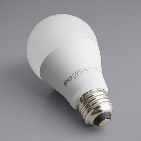 A TCP dimmable LED light bulb in its packaging.