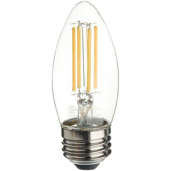 A close-up of a TCP clear LED filament light bulb with a clear base.