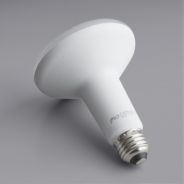 A TCP Elite dimmable LED light bulb with a white cylinder and white light.