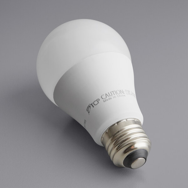 A TCP dimmable blue LED light bulb in white packaging.
