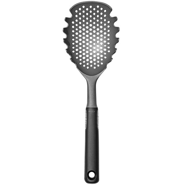 An OXO Good Grips gray pasta scoop with a handle and holes in it.