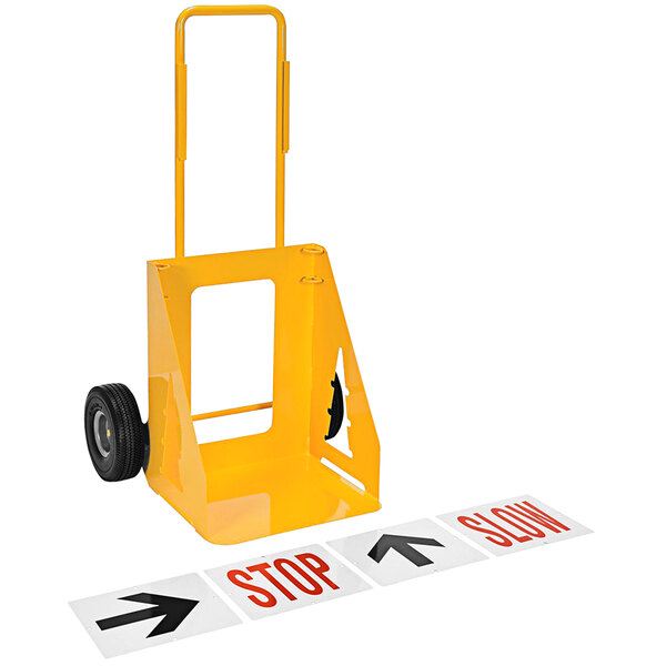 A yellow hand truck with a wheel and a sign.