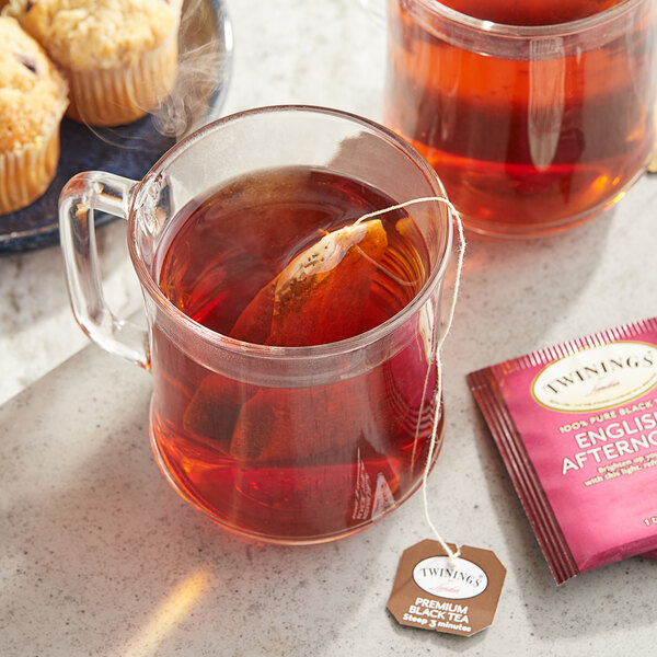A glass mug of Twinings English Afternoon Tea with a tea bag in it.