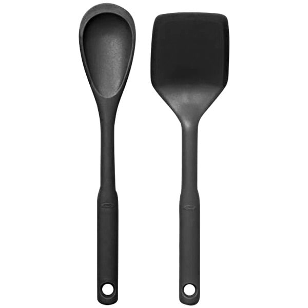 A close-up of two black OXO Good Grips spatulas.
